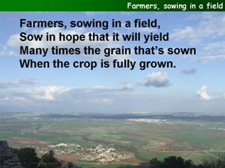 Farmers, sowing in a field